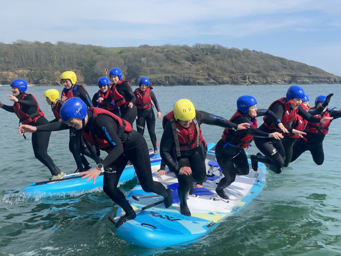 People Falling from Mega-SUP - Adventure South - Salcombe Devon People Falling from Mega-SUP - Adventure South - Salcombe Devon
